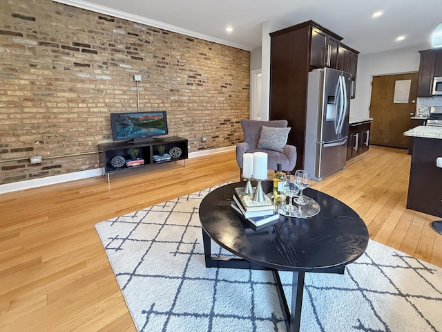 1325 W Addison St Unit 1A, Chicago, IL 60613 - living room featuring brick wall, baseboards, light wood finished floors, crown molding, and recessed lighting