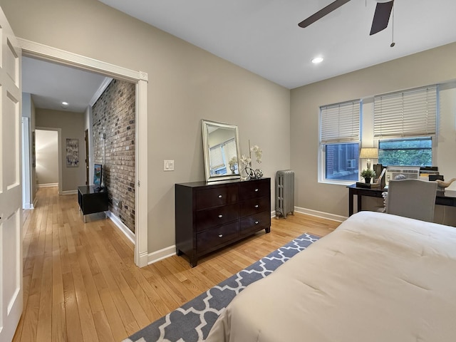 1325 W Addison St Unit 1A, Chicago, IL 60613 - bedroom featuring radiator, light wood finished floors, baseboards, a fireplace, and recessed lighting