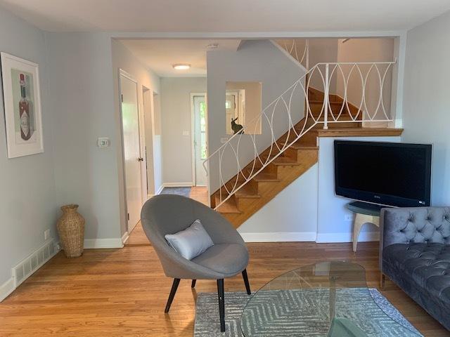 810 Skokie Blvd Unit C, Wilmette, IL 60091 - living area featuring wood finished floors, baseboards, and stairway