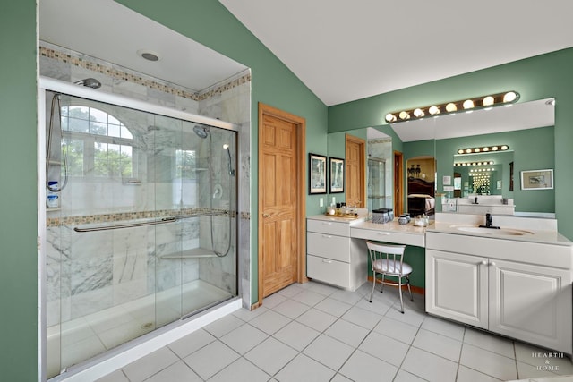5008 Country Springs Dr, Johnsburg, IL 60051 - bathroom with vanity, vaulted ceiling, a shower stall, and tile patterned floors