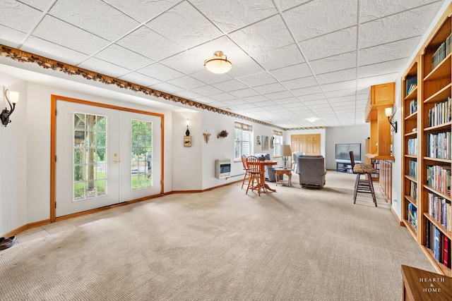 5008 Country Springs Dr, Johnsburg, IL 60051 - carpeted living area featuring heating unit, french doors, and a drop ceiling