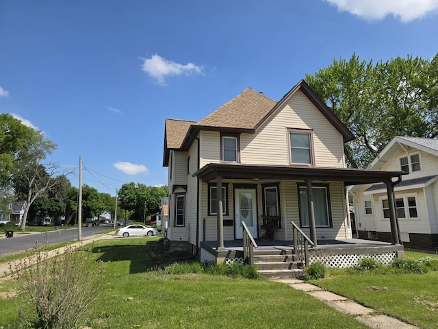 401 Dixon Ave, Rock Falls, IL 61071 - view of front of house with a porch, a front lawn, and a shingled roof