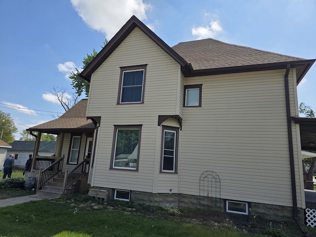 401 Dixon Ave, Rock Falls, IL 61071 - view of property exterior with a shingled roof, covered porch, and a yard