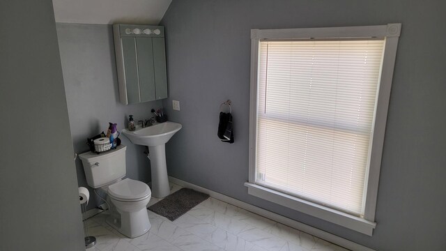 401 Dixon Ave, Rock Falls, IL 61071 - bathroom featuring toilet, marble finish floors, baseboards, and healthy amount of natural light