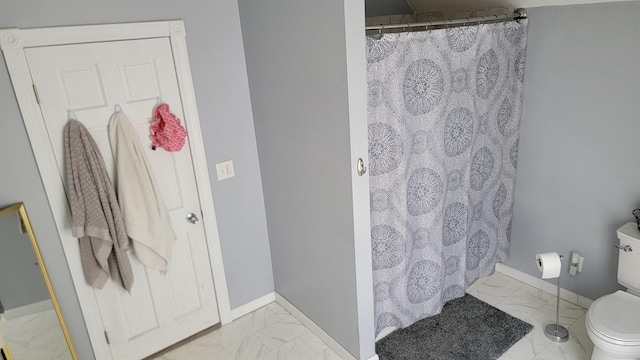 401 Dixon Ave, Rock Falls, IL 61071 - full bathroom featuring marble finish floors, toilet, baseboards, and a shower with shower curtain