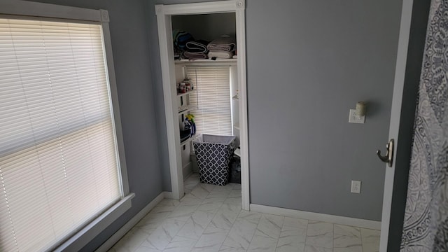 401 Dixon Ave, Rock Falls, IL 61071 - hallway featuring light marble finish flooring and baseboards