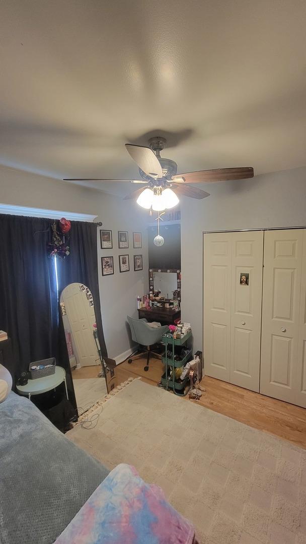 401 Dixon Ave, Rock Falls, IL 61071 - bedroom featuring a ceiling fan, wood finished floors, a closet, and arched walkways