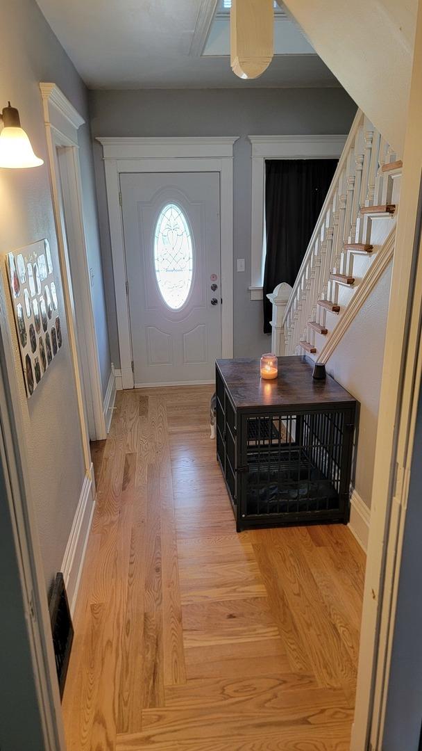 401 Dixon Ave, Rock Falls, IL 61071 - foyer with stairway, light wood-style flooring, and baseboards