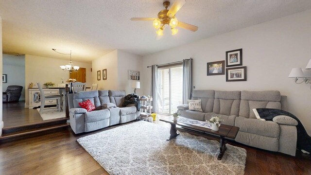 2702 Worcester Dr, Champaign, IL 61821 - living area with a chandelier, ceiling fan, hardwood / wood-style floors, and a textured ceiling