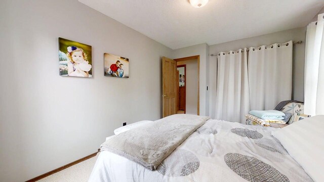 2702 Worcester Dr, Champaign, IL 61821 - bedroom with carpet floors and baseboards