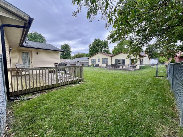 2702 Worcester Dr, Champaign, IL 61821 - back of house featuring central AC, a deck, a lawn, and a chimney