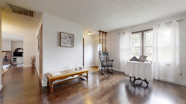 2702 Worcester Dr, Champaign, IL 61821 - sitting room with a textured ceiling, wood finished floors, and baseboards