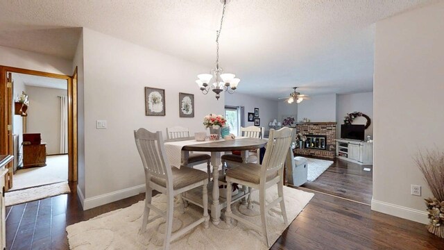 2702 Worcester Dr, Champaign, IL 61821 - dining area with ceiling fan, baseboards, dark wood finished floors, a chandelier, and a textured ceiling