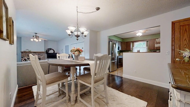 2702 Worcester Dr, Champaign, IL 61821 - dining area with a ceiling fan, dark wood-style flooring, a chandelier, and baseboards