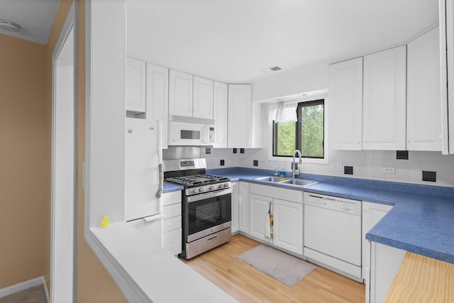 1044 Creekside Ct Unit 2A, Wheeling, IL 60090 - kitchen with white appliances, a sink, and white cabinetry
