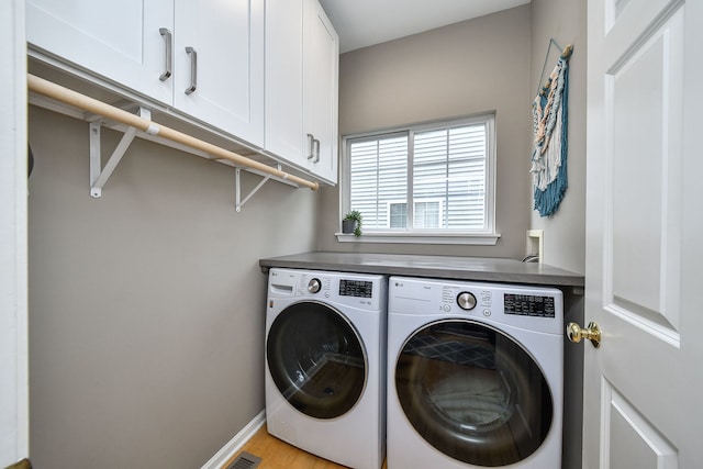 1817 2nd Pl, Saint Charles, IL 60174 - washroom featuring independent washer and dryer, cabinet space, baseboards, and light wood-style flooring