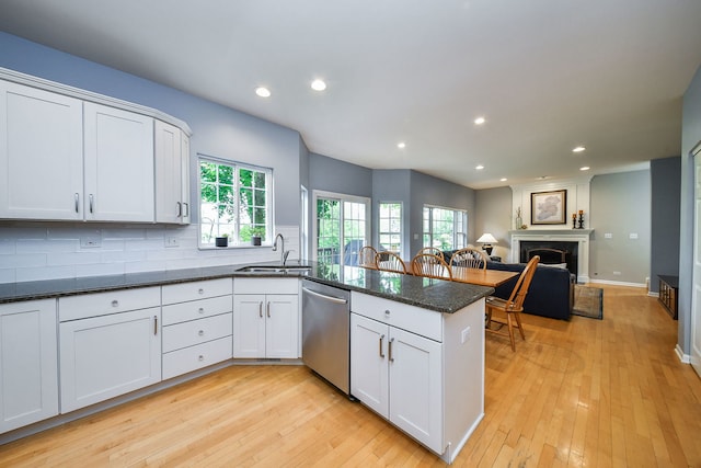 1817 2nd Pl, Saint Charles, IL 60174 - kitchen with stainless steel dishwasher, a sink, a peninsula, recessed lighting, and white cabinets
