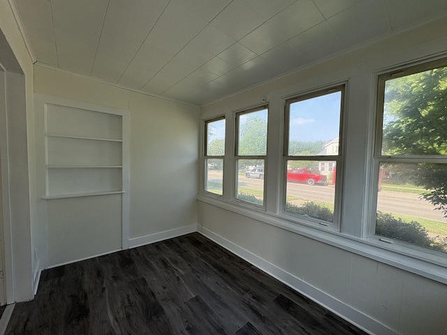 908 N Park St, Streator, IL 61364 - unfurnished sunroom with plenty of natural light, wood finished floors, baseboards, and ornamental molding