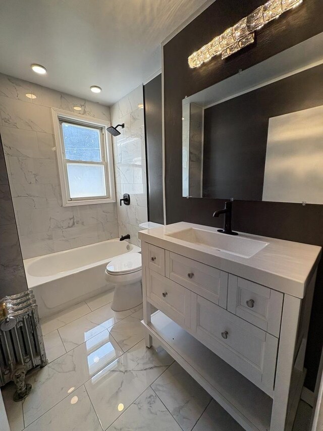 908 N Park St, Streator, IL 61364 - full bathroom featuring bathing tub / shower combination, vanity, toilet, and marble look tiles
