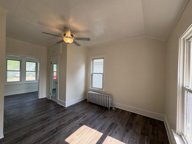 908 N Park St, Streator, IL 61364 - unfurnished room with radiator, dark wood-style floors, ceiling fan, baseboards, and lofted ceiling