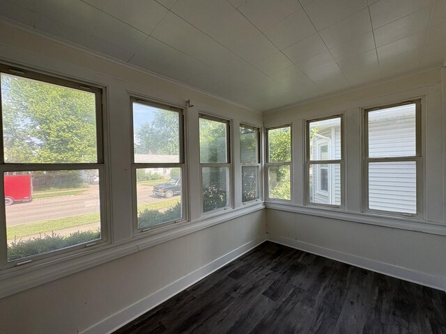 908 N Park St, Streator, IL 61364 - unfurnished sunroom featuring plenty of natural light, wood finished floors, baseboards, and ornamental molding