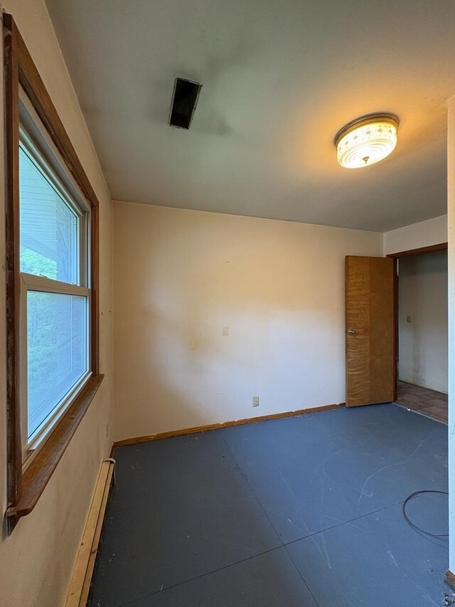 1515 Johnson St, Ottawa, IL 61350 - unfurnished bedroom featuring baseboards and a baseboard heating unit