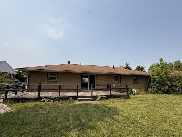 1515 Johnson St, Ottawa, IL 61350 - rear view of house with a wooden deck, a lawn, and brick siding