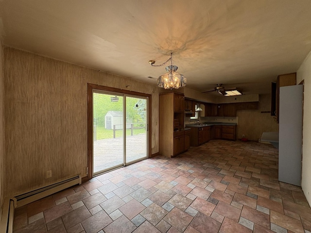 1515 Johnson St, Ottawa, IL 61350 - kitchen with a chandelier, ceiling fan, a baseboard radiator, hanging light fixtures, and stone finish flooring