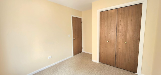 2338 S Canal St Unit H, Chicago, IL 60616 - unfurnished bedroom featuring a closet, carpet floors, and baseboards