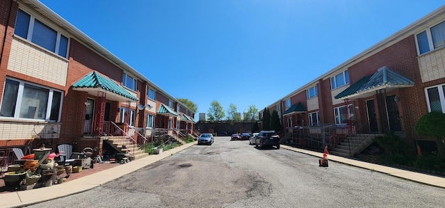 2338 S Canal St Unit H, Chicago, IL 60616 - view of asphalt road featuring a residential view, sidewalks, and curbs