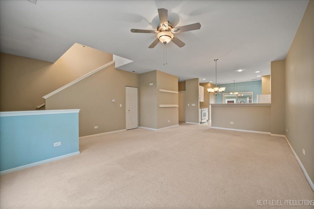 1218 Mariemont Rd Unit C, Sugar Grove, IL 60554 - unfurnished living room featuring a ceiling fan, a chandelier, baseboards, and light carpet