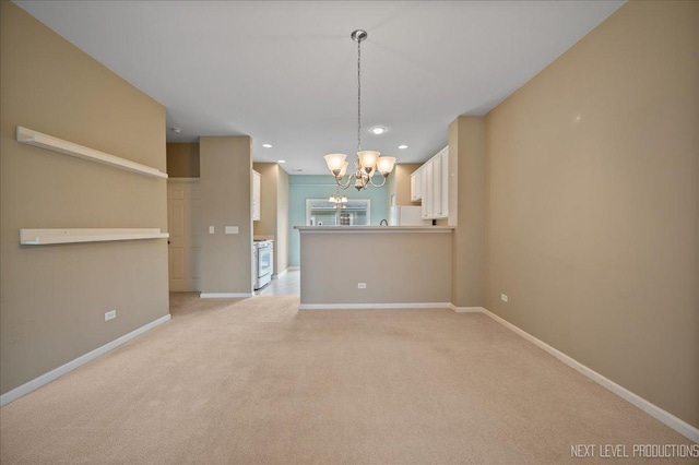 1218 Mariemont Rd Unit C, Sugar Grove, IL 60554 - spare room with a chandelier, light carpet, baseboards, and recessed lighting