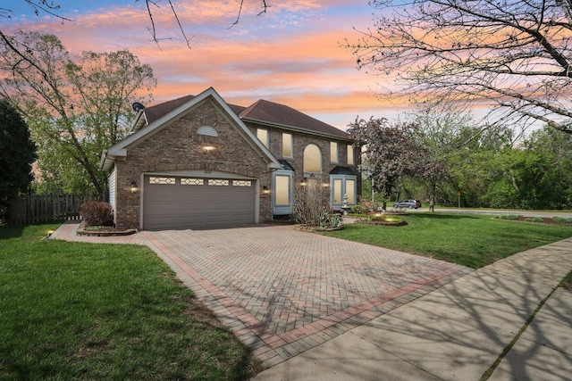 1337 E Thacker St, Schaumburg, IL 60173 - traditional home featuring decorative driveway, a garage, and brick siding