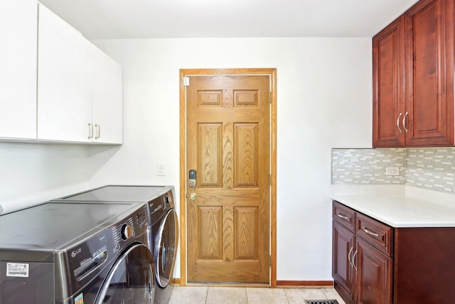 1337 E Thacker St, Schaumburg, IL 60173 - laundry room with cabinet space, separate washer and dryer, baseboards, and light tile patterned flooring