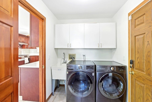 1337 E Thacker St, Schaumburg, IL 60173 - laundry room featuring cabinet space, washing machine and dryer, and light tile patterned floors