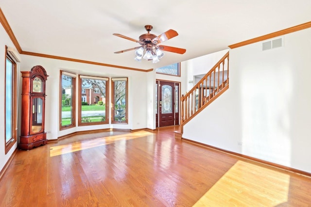 1337 E Thacker St, Schaumburg, IL 60173 - entrance foyer featuring baseboards, wood finished floors, ceiling fan, stairway, and ornamental molding