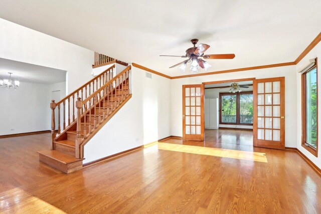 1337 E Thacker St, Schaumburg, IL 60173 - unfurnished living room featuring wood finished floors, stairway, baseboards, and ornamental molding