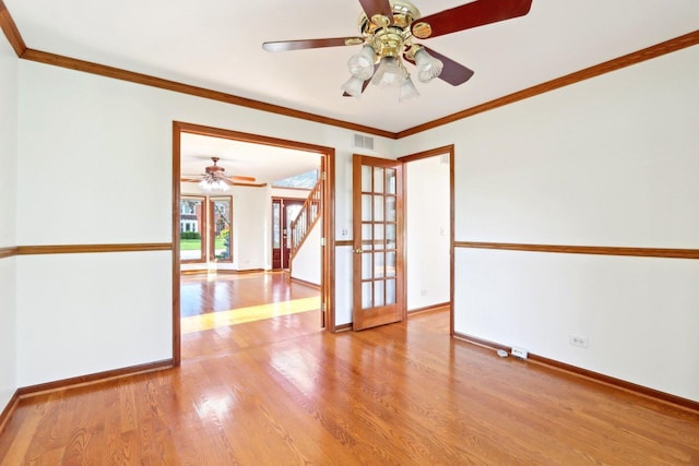1337 E Thacker St, Schaumburg, IL 60173 - spare room featuring a ceiling fan, wood finished floors, baseboards, and ornamental molding