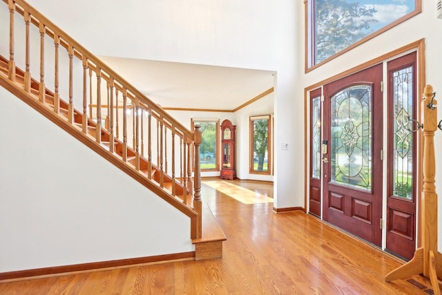 1337 E Thacker St, Schaumburg, IL 60173 - foyer with stairway, baseboards, wood finished floors, a high ceiling, and ornamental molding