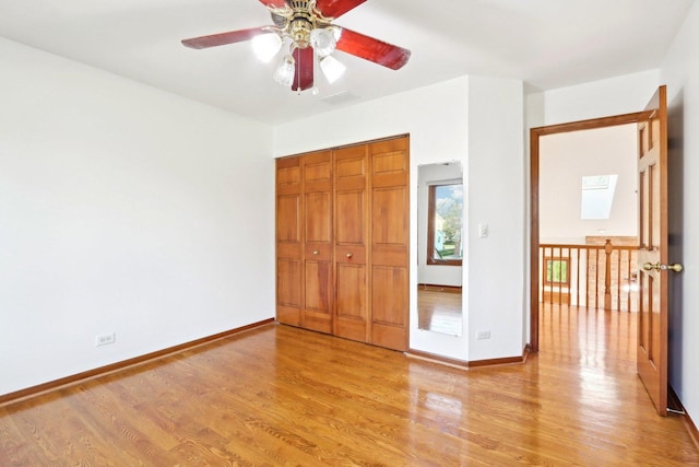 1337 E Thacker St, Schaumburg, IL 60173 - unfurnished bedroom featuring light wood finished floors, a closet, and baseboards