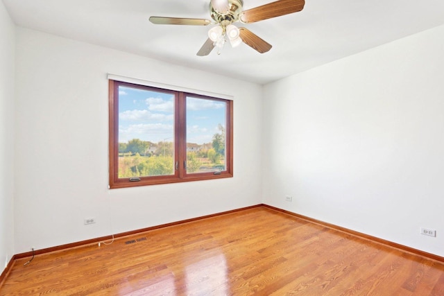 1337 E Thacker St, Schaumburg, IL 60173 - unfurnished room with wood finished floors, baseboards, and ceiling fan