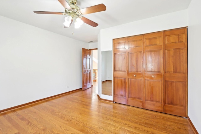 1337 E Thacker St, Schaumburg, IL 60173 - unfurnished bedroom featuring light wood-style flooring, a closet, baseboards, and a ceiling fan
