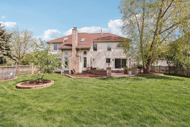 1337 E Thacker St, Schaumburg, IL 60173 - rear view of house featuring a chimney and a patio area
