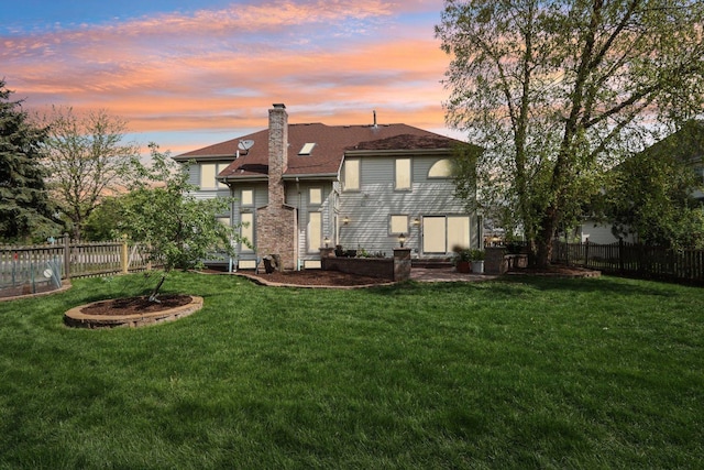 1337 E Thacker St, Schaumburg, IL 60173 - rear view of house with a chimney and roof with shingles