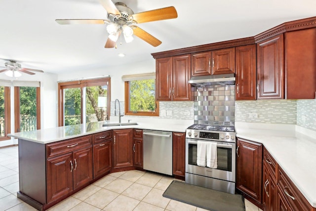 1337 E Thacker St, Schaumburg, IL 60173 - kitchen with appliances with stainless steel finishes, a sink, under cabinet range hood, a ceiling fan, and light countertops