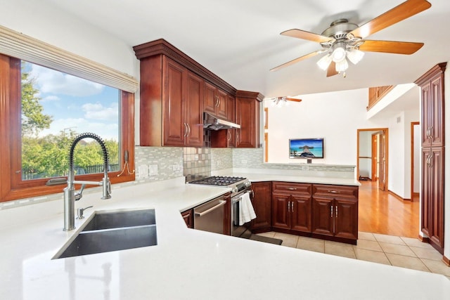 1337 E Thacker St, Schaumburg, IL 60173 - kitchen with a sink, under cabinet range hood, stainless steel appliances, light countertops, and tasteful backsplash
