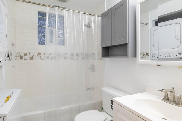 2512 N Marshfield Ave, Chicago, IL 60614 - bathroom featuring stacked washer / drying machine, shower / bath combo with shower curtain, vanity, and toilet