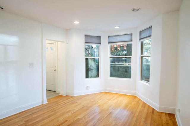 2512 N Marshfield Ave, Chicago, IL 60614 - empty room with light wood-style floors, baseboards, and recessed lighting