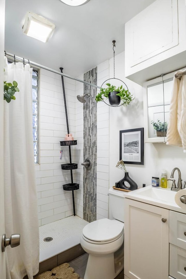 2512 N Marshfield Ave, Chicago, IL 60614 - full bath with vanity, toilet, and a shower stall