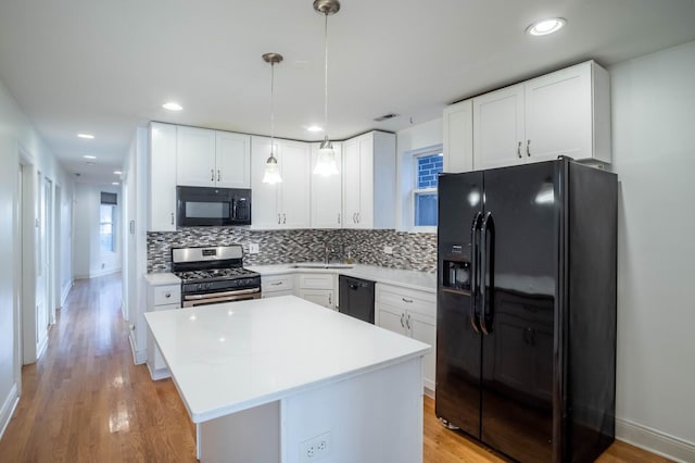 2512 N Marshfield Ave, Chicago, IL 60614 - kitchen with black appliances, backsplash, a sink, light countertops, and light wood finished floors